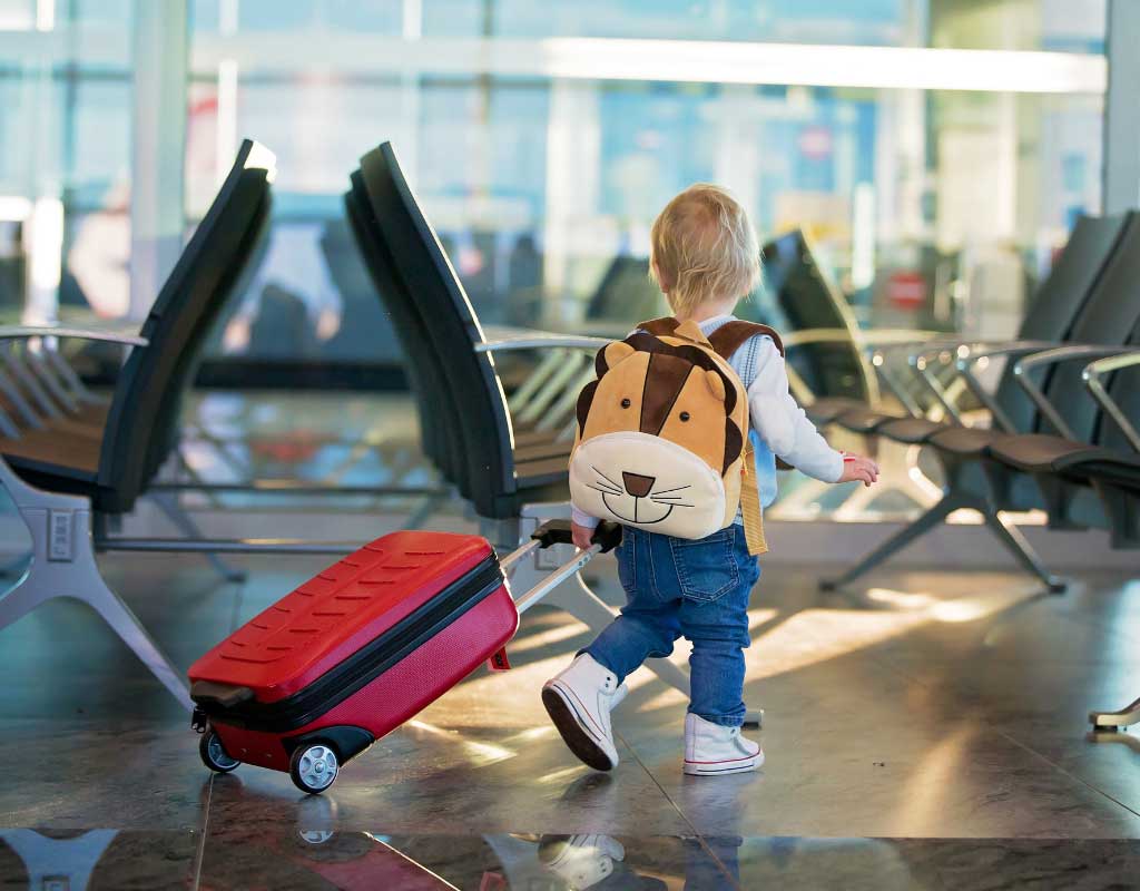 a child with a luggage