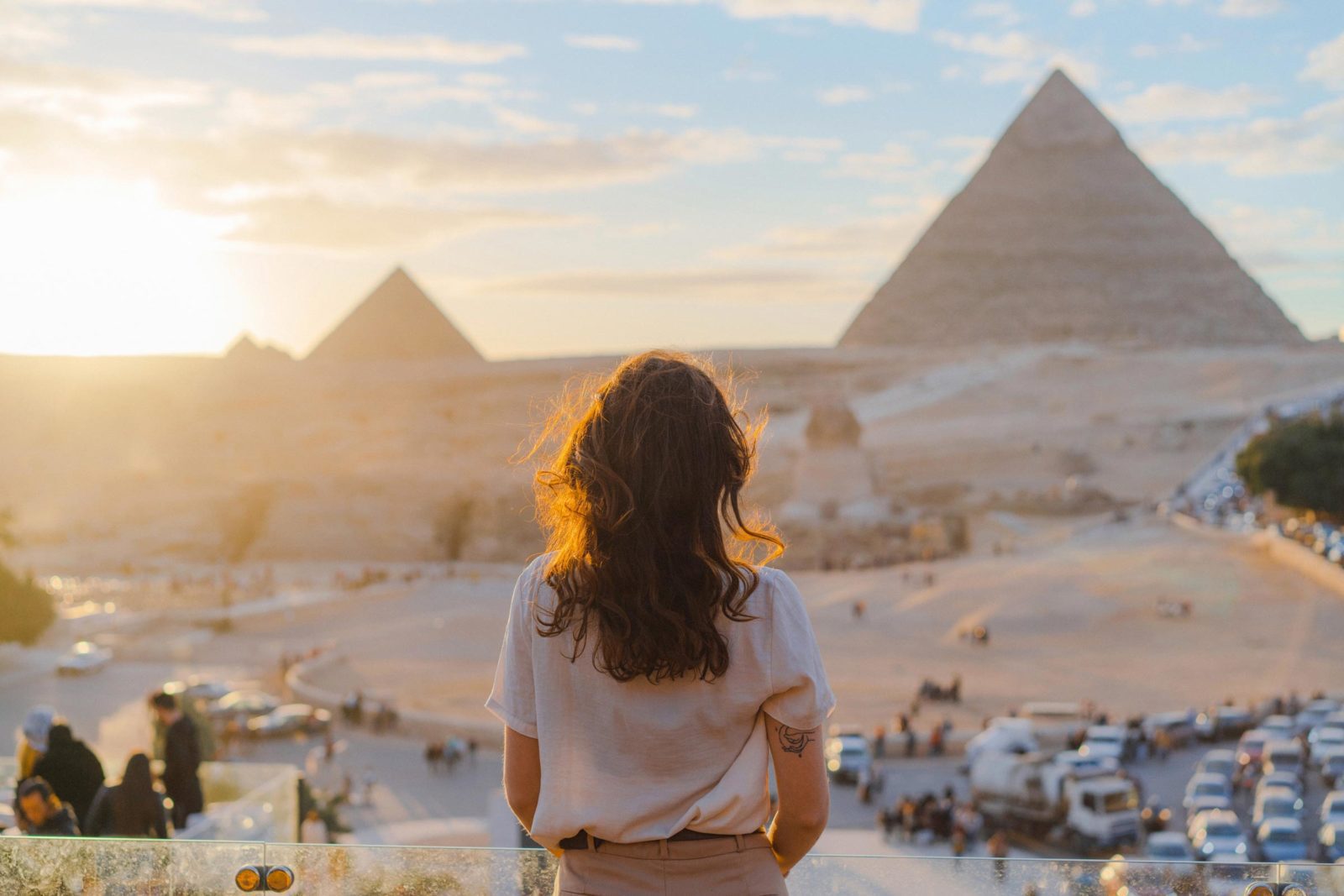 Woman looking at Giza Pyramids